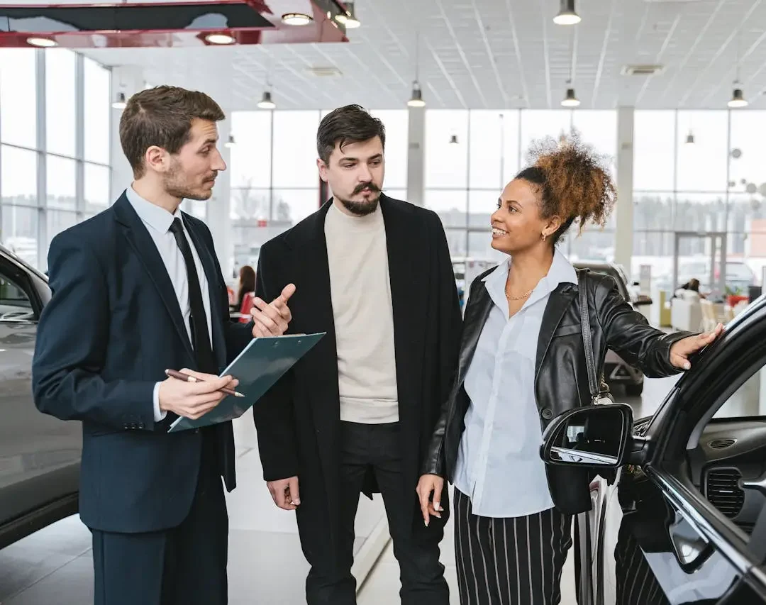car-salesman-talking-to-customers